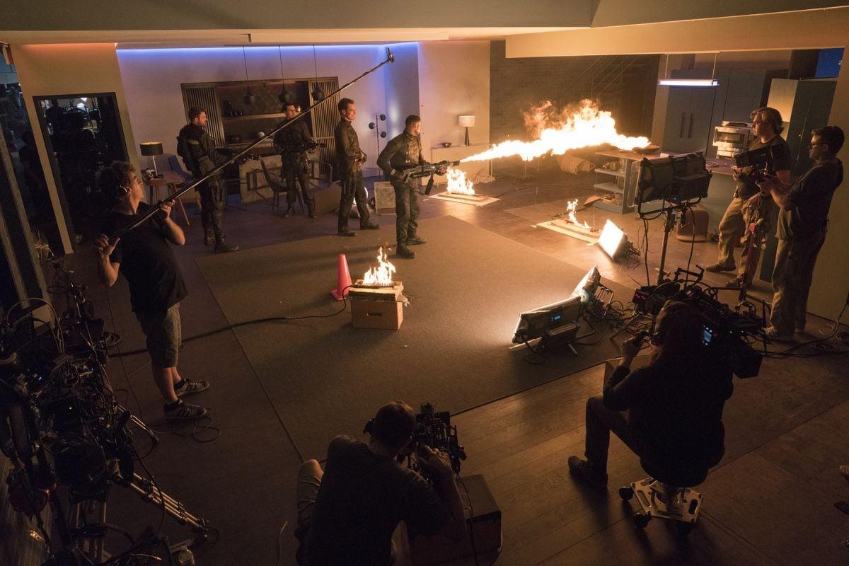 Flame bars provide additional firelight — which is further bolstered by Arri SkyPanel LED units — as two cameras capture the action.