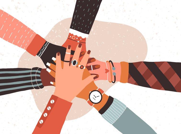 Vector illustration of a diverse group of hands one on top of the other signifying unity