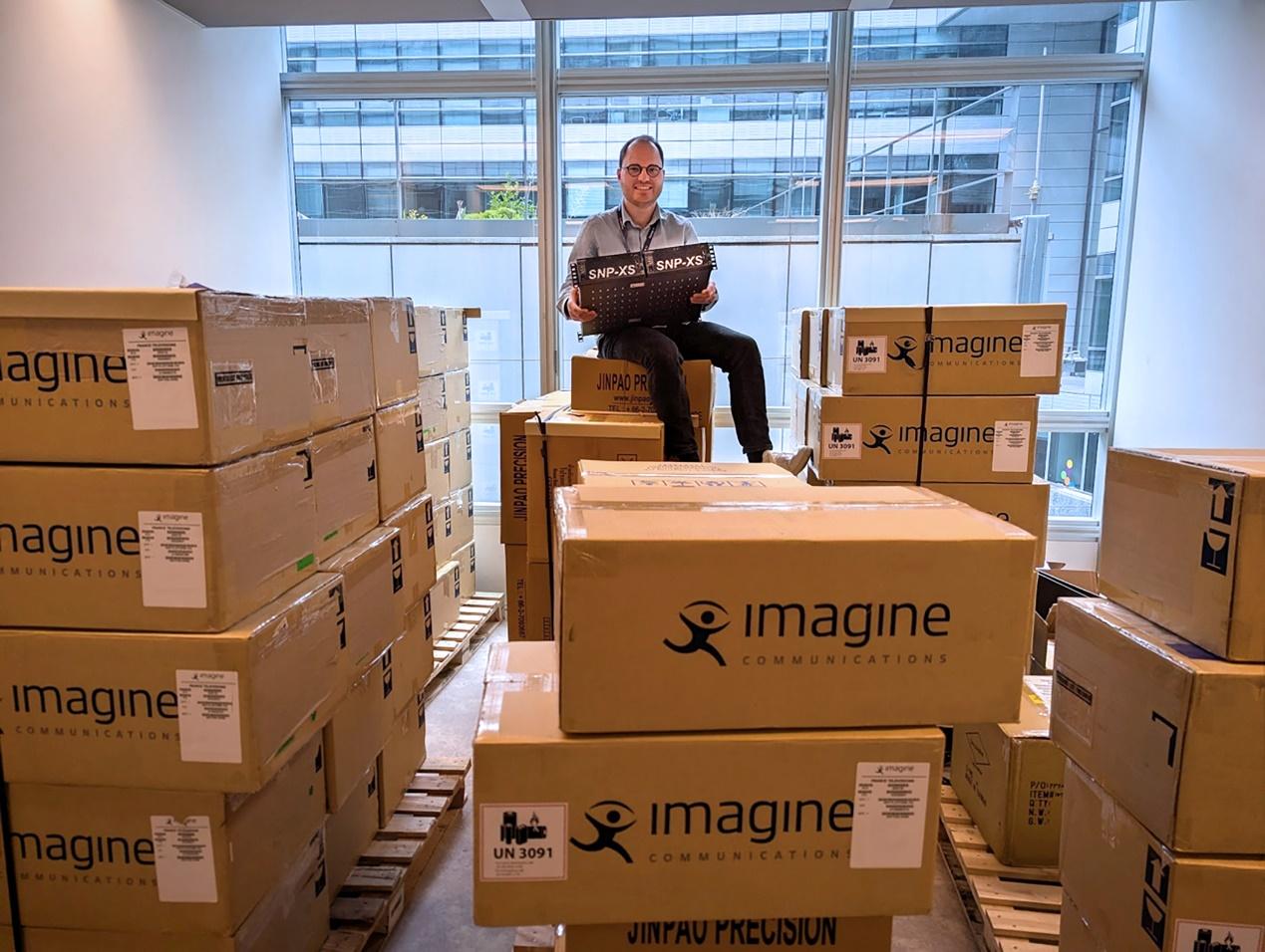 Yannick Olivier of France Télévisions sits atop a newly delivered batch of Imagine SNP–XS units, highlighting the broadcaster’s large–scale deployment.